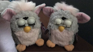 A regular Leopard Furby (left) next to a Fresh New Look Leopard Furby (right)