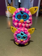 A Pink Cubes Furbling with its Furby Boom counterpart.