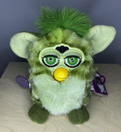 Alligator Furby with neon green eyes