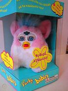 A Greek Baby Pink Furby in its box