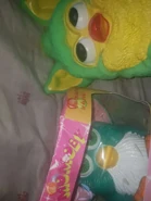 a green furby fake bank next to Momoby (McFurby-like Furby Fake)