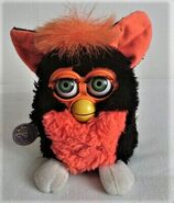 A Tart Tangerine Furby with Green Eyes