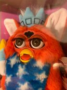 A NIB Patriotic furby with brown eyes