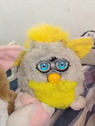 Banana Peel Furby with neon blue eyes