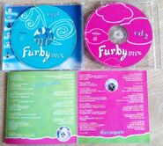 Another photo showing the CD's in the second version of Furby Mix's album.