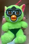 A Humanoid Green Furby Fake with a red keyring instead of black