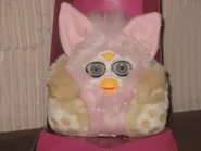 A pink and tan Purby