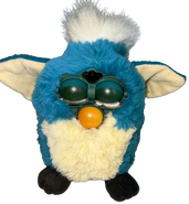 Dragon Furby with discolored eyelids, and faceplate