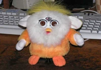 an orange Purby with hands