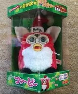 A boxed japanese Santa Furby