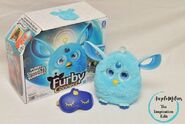 A Light Blue Connect next to its box and sleep mask