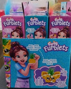 Side of the 12 Furblets series 3 display box