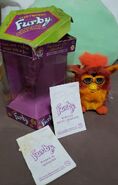 English Rooster Furby with a Portuguese box and instructions