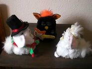 The Replica Bejewelled Furby interacting with a replica of the Christmas Snowman Furby, and Replica Rockstar Furby.