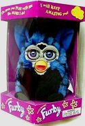 A boxed Blue Turtle Furby