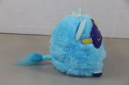 Side view of a blue Furby Connect with its sleep mask on
