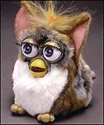 A brown and white prototype 1998 Furby