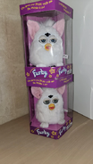 two snowball furbys in box stacked ontop of each other.