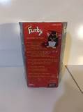 The back of the Graduation Furby