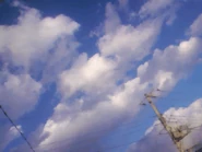 A telephone pole can be seen in the foreground