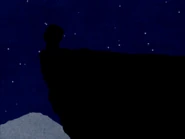 Mogekov Hashasky standing on a cliff