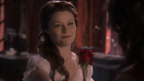 1x12 Belle rose sourire Rumplestiltskin.png