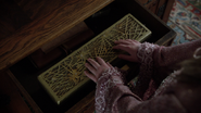 The box where Cora's wand is kept in "Sisters"