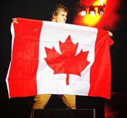 Liam holding the Canadian flag.