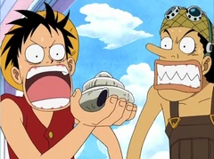En Ruffy i l'Usopp sorpresos en veure els efectes d'un dial tonal.
