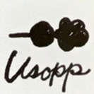 Usopp's autograph, which says "To Bartolomeo" and his name.