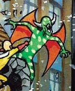 Green, spotted, winged demon being punched by Saitama through a building in the back cover of Volume 1