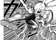 Genos reconnects his body after being cut in half at the waist
