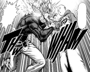 Saitama chops Garou in the shoulder.