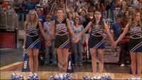 The cheerleaders hold hands in the hope of winning the State Championship