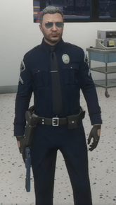 Nolan with his gun drawn