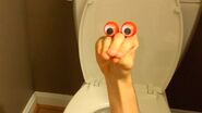 Edgy-Oobi-hand-puppets-Uma-Job-Guy-on-the-toilet