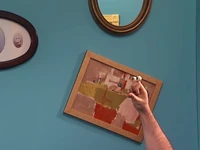 Hanging a painting