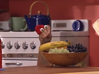 Kako with a banana in the fruit bowl