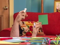 Uma holds up a square...