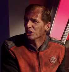 Lieutenant  moments before he is crushed by a collapsed bulkhead.