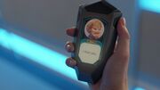  receives a text message from  on her comscanner.