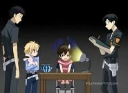 Kyoya interrogates Haruhi as Takashi and Mitsukuni watch.