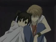 Hikaru comforts Haruhi during the thunderstorm that occurs during their date