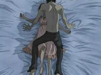 Kyoya forces Haruhi into a compromising position.