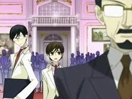 Kyoya listens as Haruhi bravely stands up to his father.