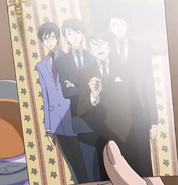 A photo of Kyoya with his family in Renge's hand