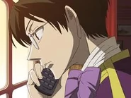 Kyoya spots Tamaki leaving Ouran as he listens to Shima.