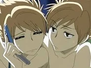 Hikaru sadly listens to Tamaki on the phone as Kaoru watches on...