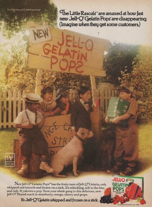 Buckwheat, Darla, Scotty, Pete, and Alfalfa watch as Spanky arrives with more Pops.