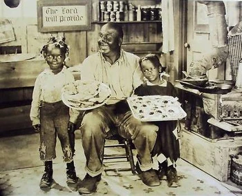 Uncle Tom between Farina and Mango in 